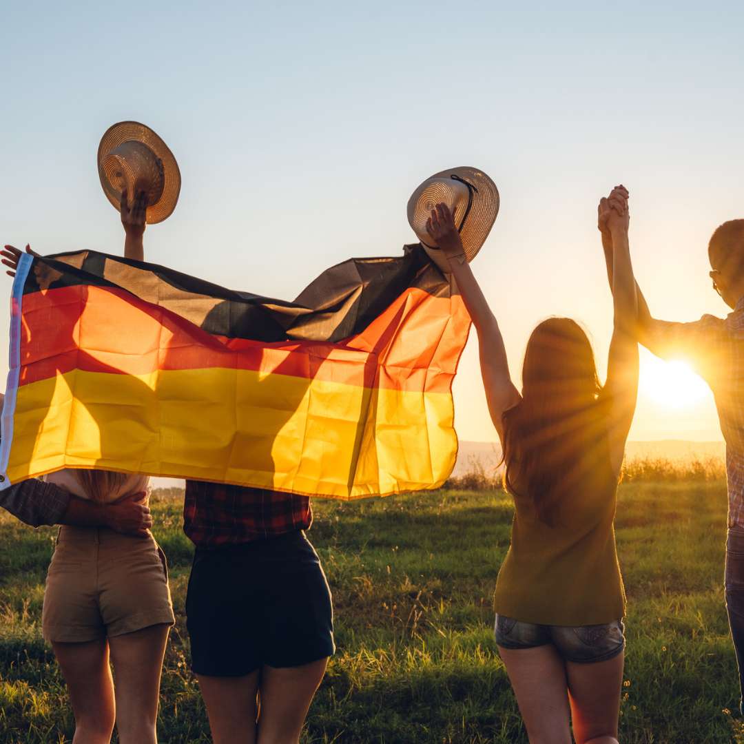 German students holding a flag
